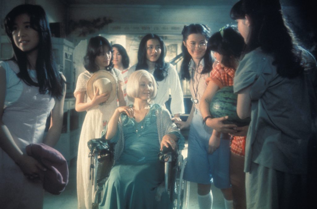 The main characters: Kumiko Oba ("Fantasy"), Masayo Miyako ("Sweet"), Eriko Tanaka ("Melody"), Kimiko Ikegami ("Gorgeous"), Ai Matsubara ("Prof"), Mieko Sato ("Mac"), Miki Jinbo ("Kung Fu"); seated: Yoko Minamida ("Gorgeous's Aunt")